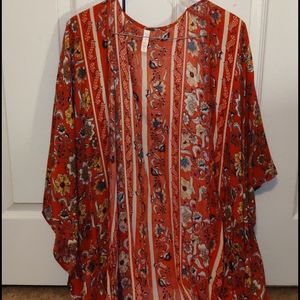 Fringed red and floral cardigan.